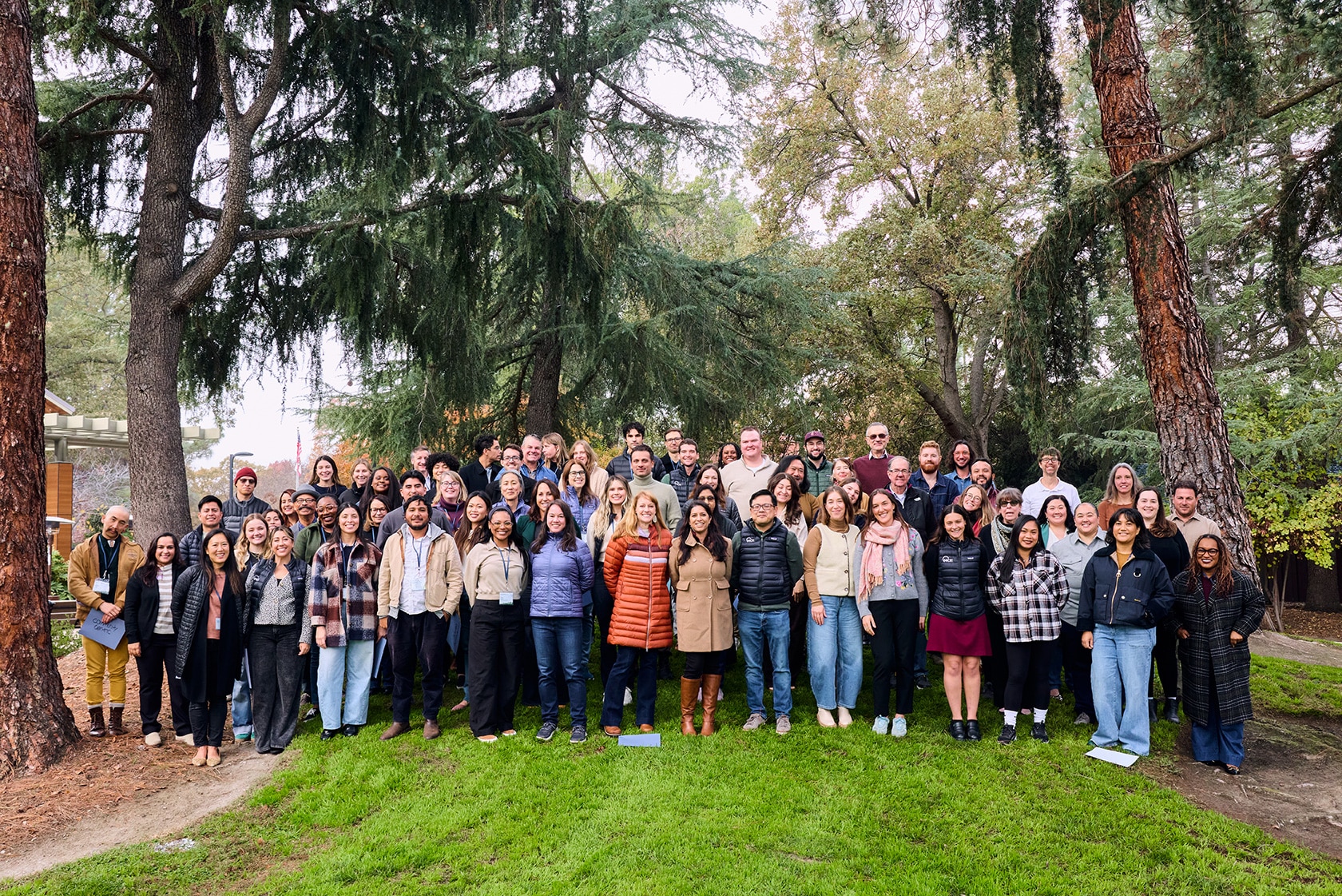 Header, group shot from staff retreat 2023, includes some former staff