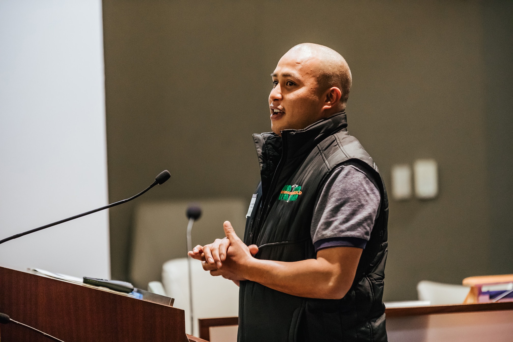 Jonathan Brito RichmondBUILD graduate, MCE Solar One employee speaking at a podium