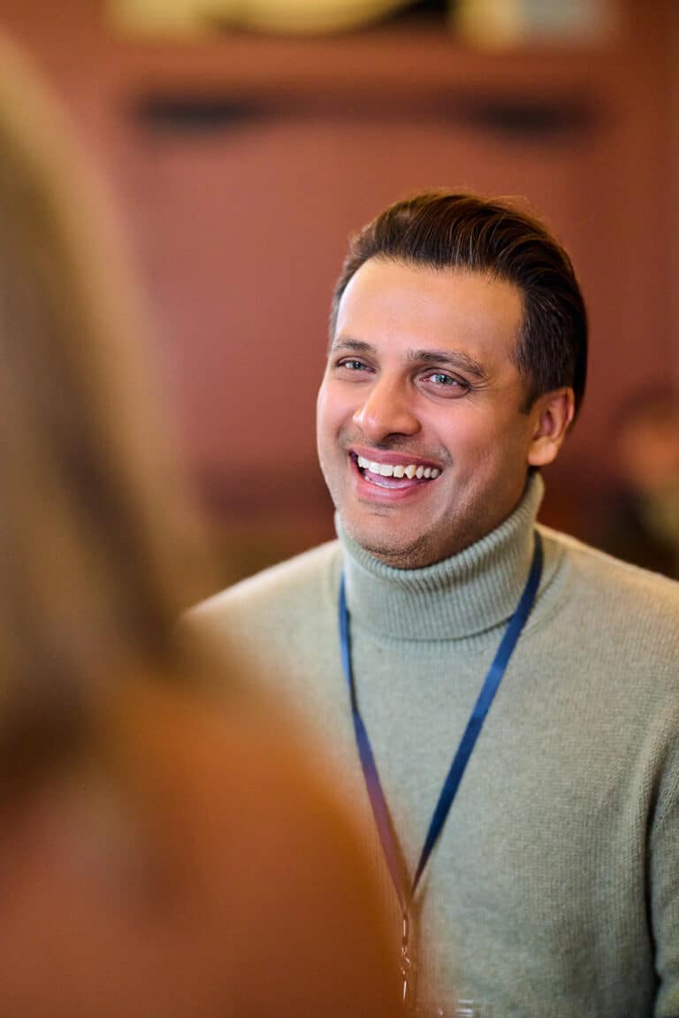 Smiling MCE employee conversing with a customer